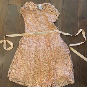 This is a size 10 peachy sequence with gold dress